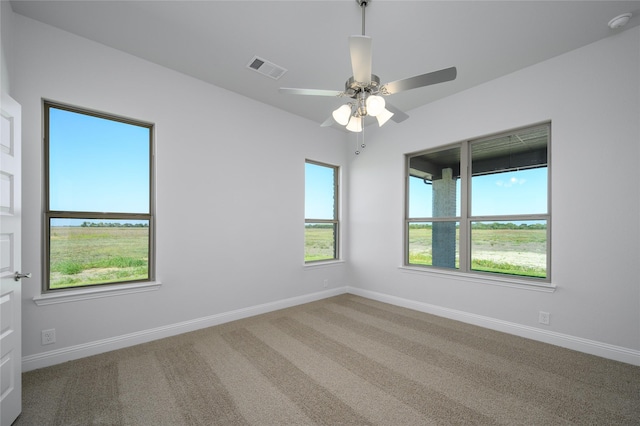 carpeted empty room with ceiling fan