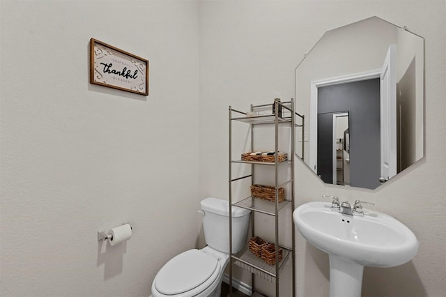 bathroom with toilet and sink