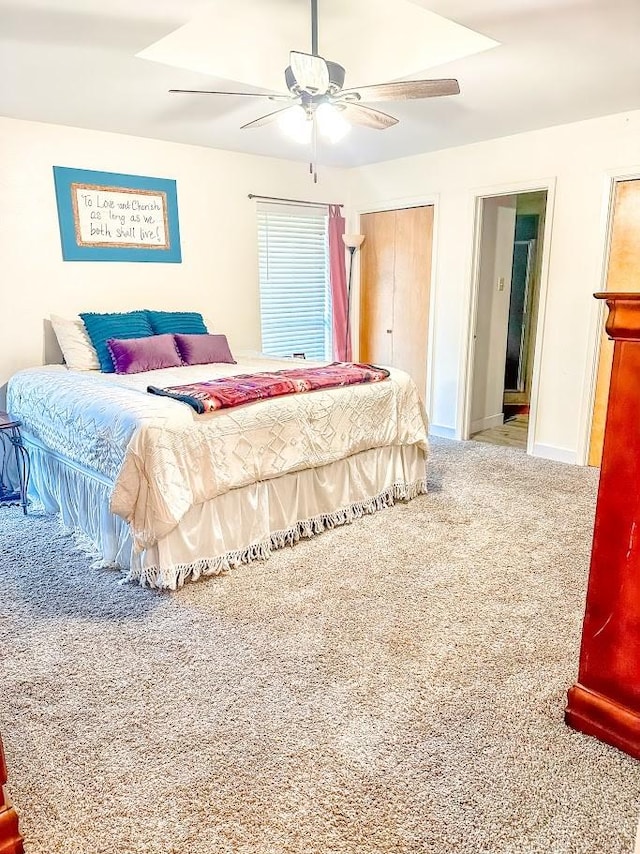 carpeted bedroom with ceiling fan