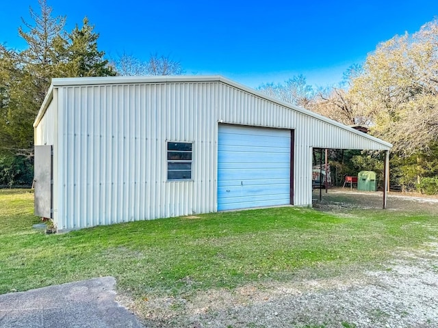 garage featuring a yard