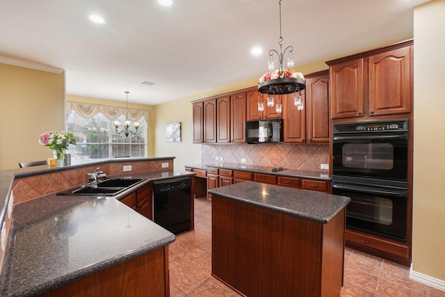 kitchen with a center island, sink, hanging light fixtures, backsplash, and black appliances