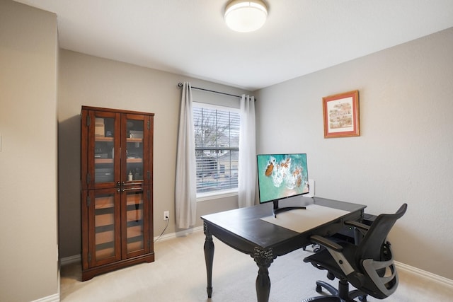 office area featuring light colored carpet