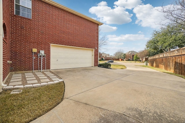 view of side of home with a garage