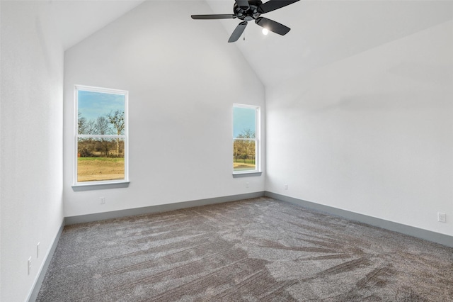 carpeted empty room featuring ceiling fan and high vaulted ceiling