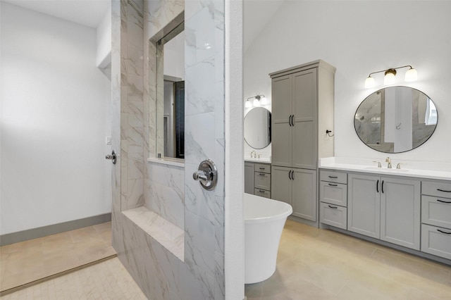 bathroom with vanity, vaulted ceiling, and a tile shower