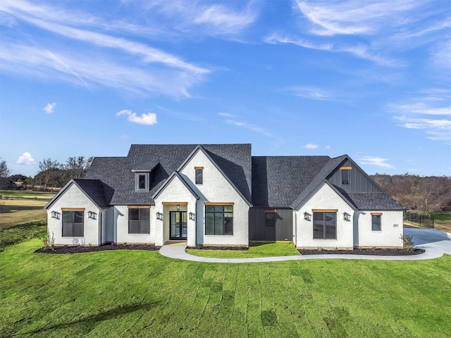 modern inspired farmhouse with a front yard