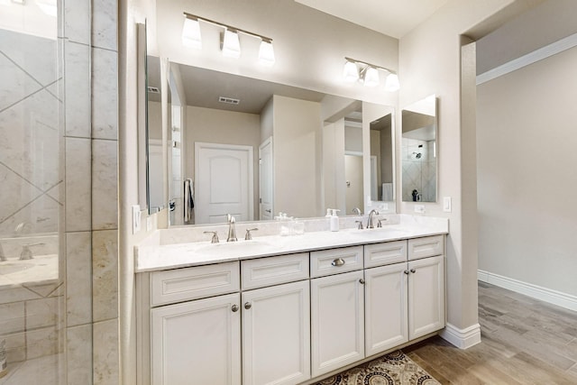 bathroom featuring vanity and wood-type flooring