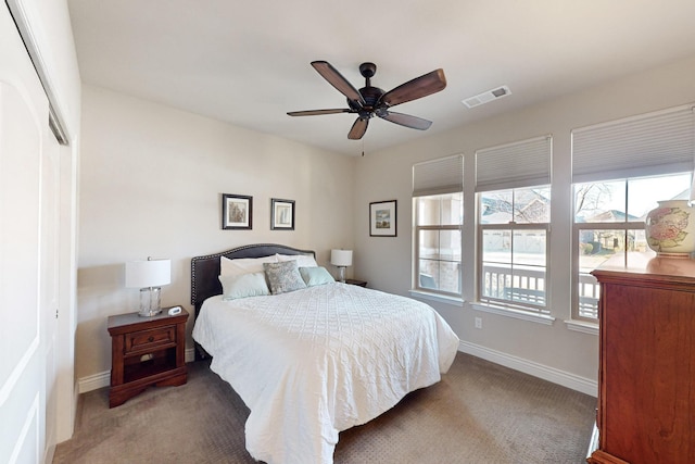 bedroom with ceiling fan, a closet, and carpet floors