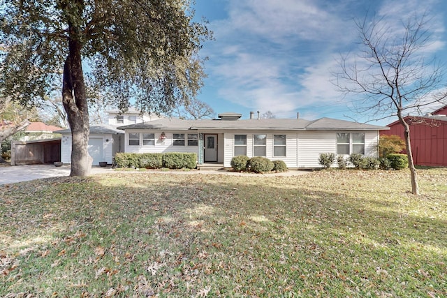 ranch-style house with a garage, a front lawn, and a storage shed