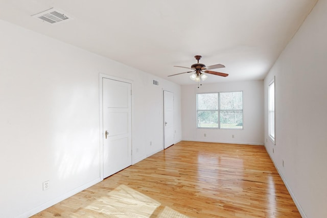 unfurnished bedroom with ceiling fan and light hardwood / wood-style flooring