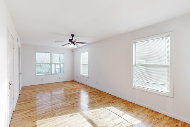 spare room featuring ceiling fan and light wood-type flooring