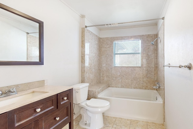 full bathroom with tile patterned floors, vanity, crown molding, toilet, and tiled shower / bath