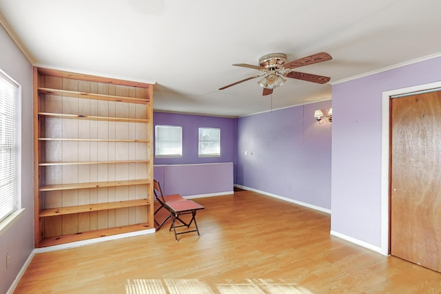 unfurnished room with ceiling fan, ornamental molding, and light hardwood / wood-style flooring