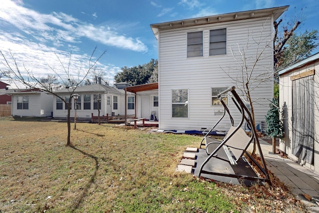 back of house with a yard