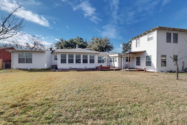 back of house with a yard