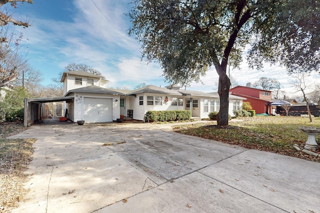 view of front of property with a carport and a front yard