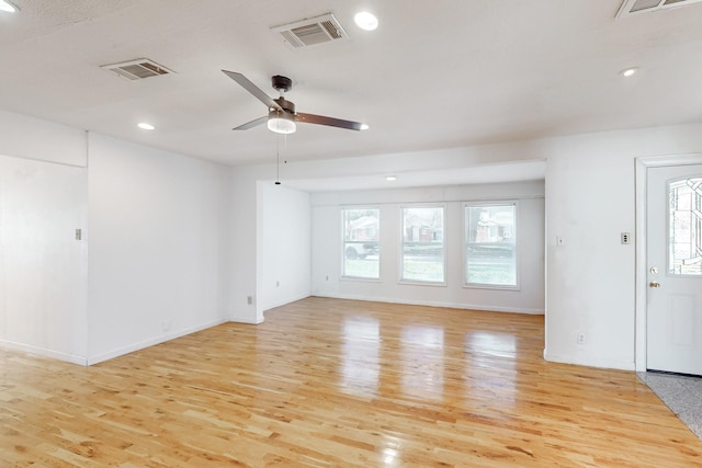 spare room with ceiling fan and light hardwood / wood-style floors