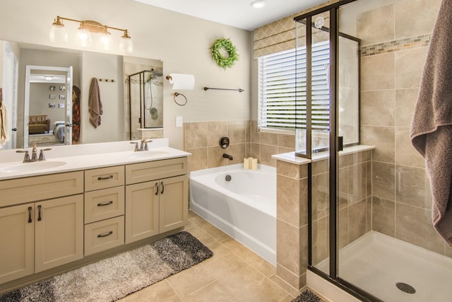 bathroom featuring tile patterned floors, vanity, and independent shower and bath