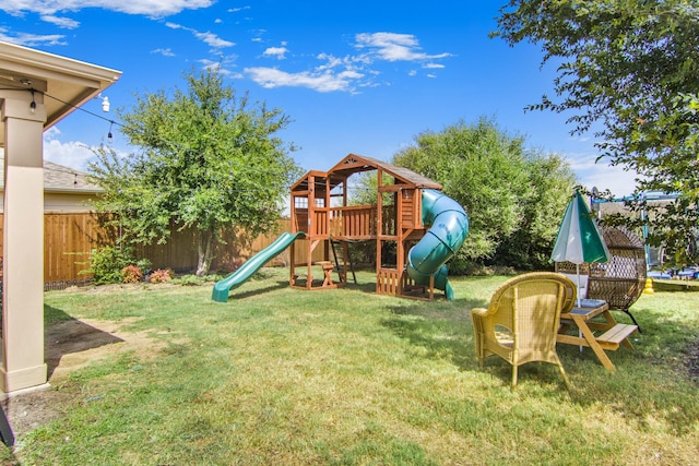 view of jungle gym with a lawn