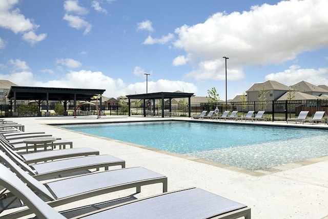 view of swimming pool with a patio area