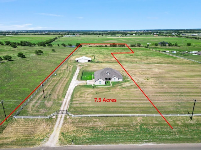 birds eye view of property with a rural view