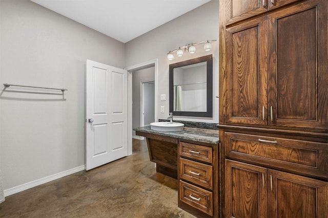 bathroom with vanity and concrete floors