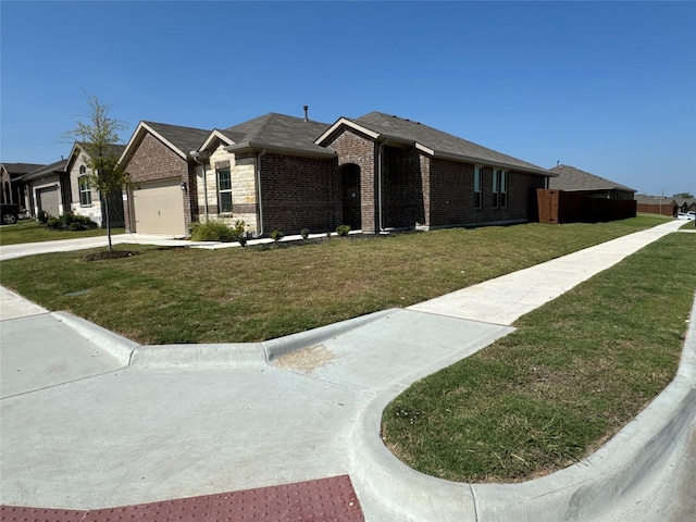 ranch-style house with a garage and a front lawn