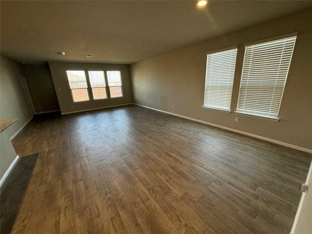 empty room with dark hardwood / wood-style floors