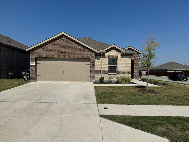 view of front of home with a front lawn and a garage