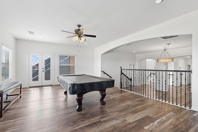 playroom featuring dark hardwood / wood-style floors, ceiling fan with notable chandelier, french doors, and billiards