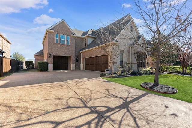 view of front of home with a front yard and a garage