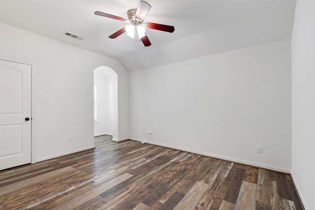 spare room with lofted ceiling, ceiling fan, and dark hardwood / wood-style floors