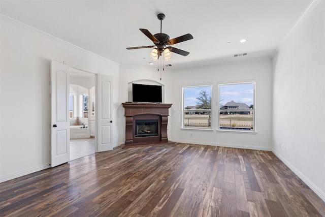 unfurnished living room featuring ceiling fan, dark hardwood / wood-style floors, and ornamental molding