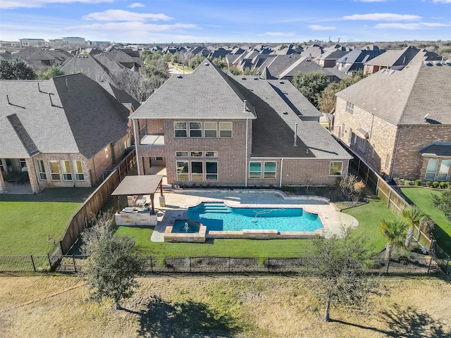 view of swimming pool featuring a patio area and a yard