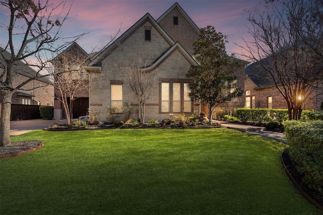 view of front of home with a lawn