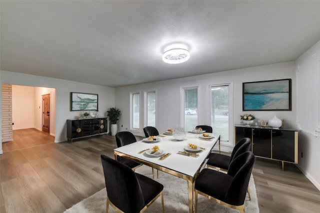 dining space featuring light wood-type flooring