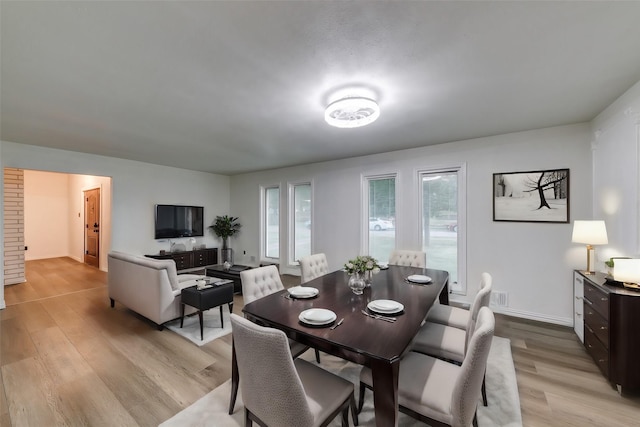 dining room with light wood-type flooring