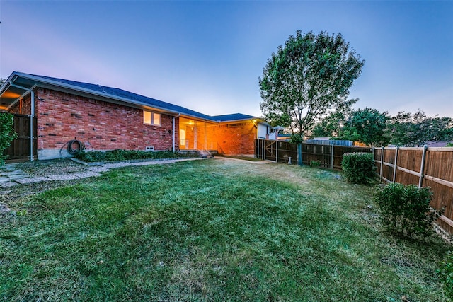 view of yard at dusk