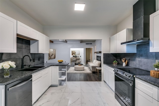 kitchen featuring black electric range oven, stainless steel dishwasher, sink, wall chimney range hood, and white cabinetry