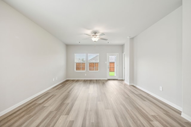 spare room with ceiling fan and light hardwood / wood-style flooring