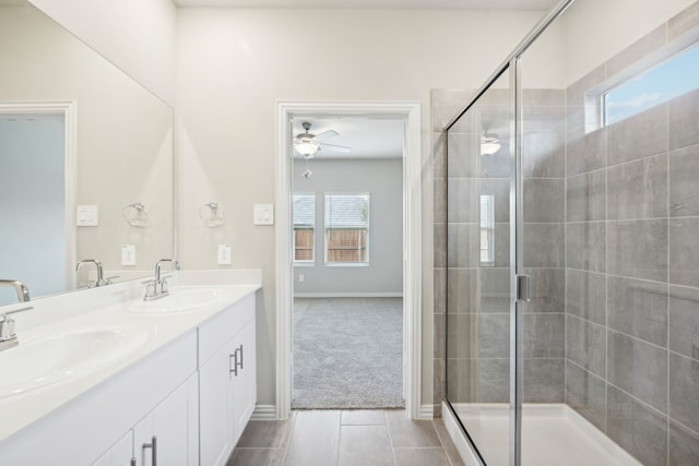 bathroom with tile patterned flooring, ceiling fan, an enclosed shower, and a wealth of natural light