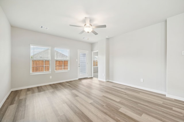 spare room featuring ceiling fan and light hardwood / wood-style flooring