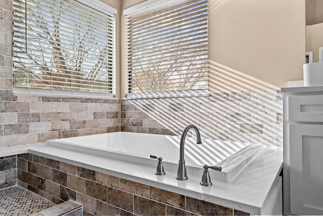 bathroom with tiled bath