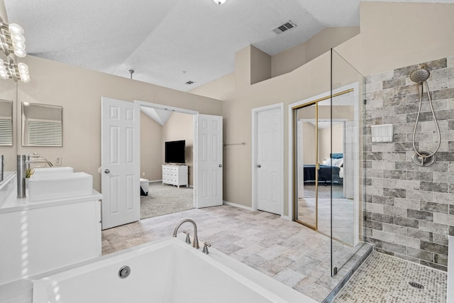 bathroom featuring plus walk in shower, a textured ceiling, and lofted ceiling