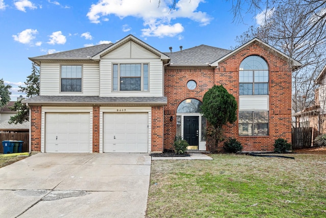 front of property featuring a front lawn and a garage