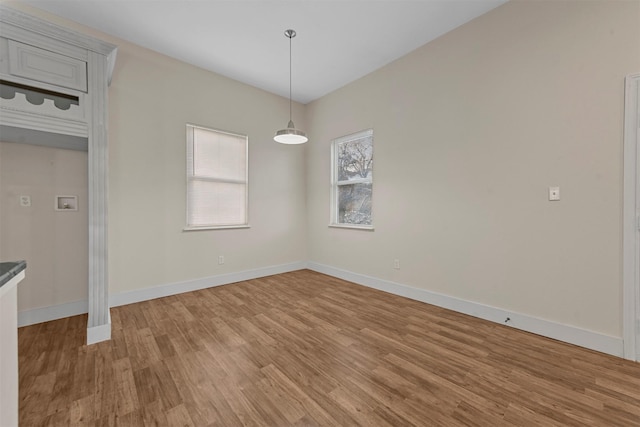 unfurnished dining area with light hardwood / wood-style flooring