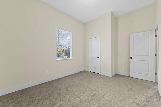 unfurnished bedroom with light colored carpet