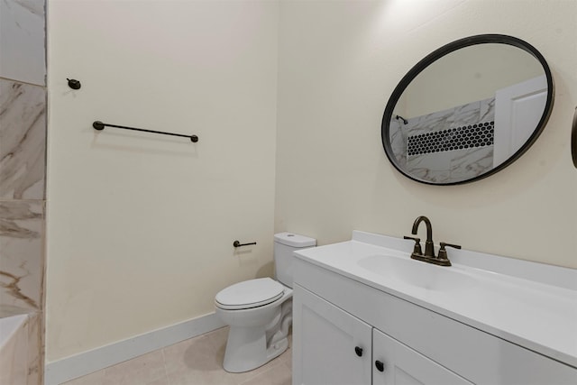 bathroom with vanity, tile patterned floors, and toilet