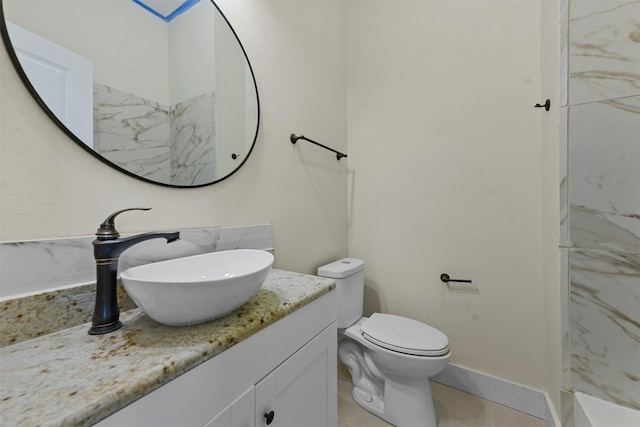 bathroom with vanity, tile patterned floors, toilet, and walk in shower