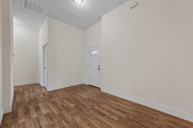 entryway with hardwood / wood-style floors